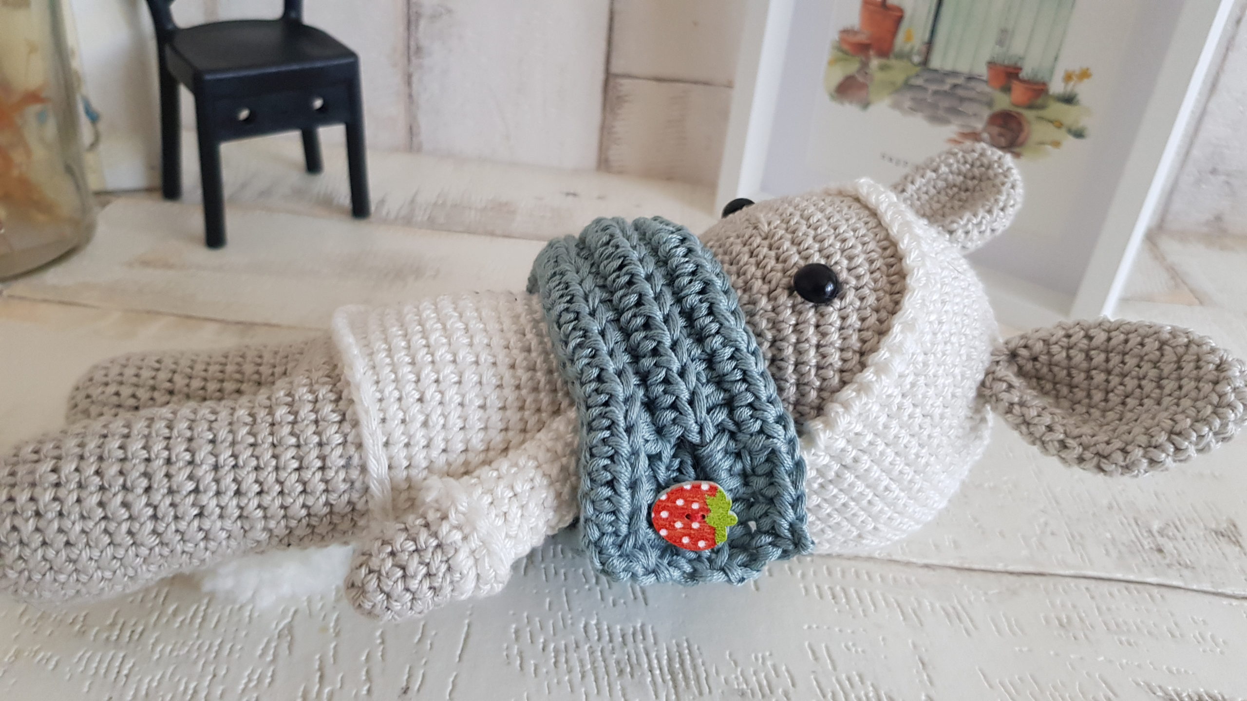 crochet bunny laying on his back