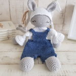 crochet bunny lovey sitting next to a picture