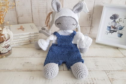 crochet bunny lovey sitting next to a picture