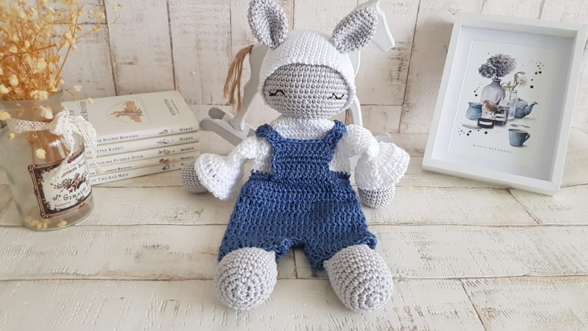 crochet bunny lovey sitting next to a picture